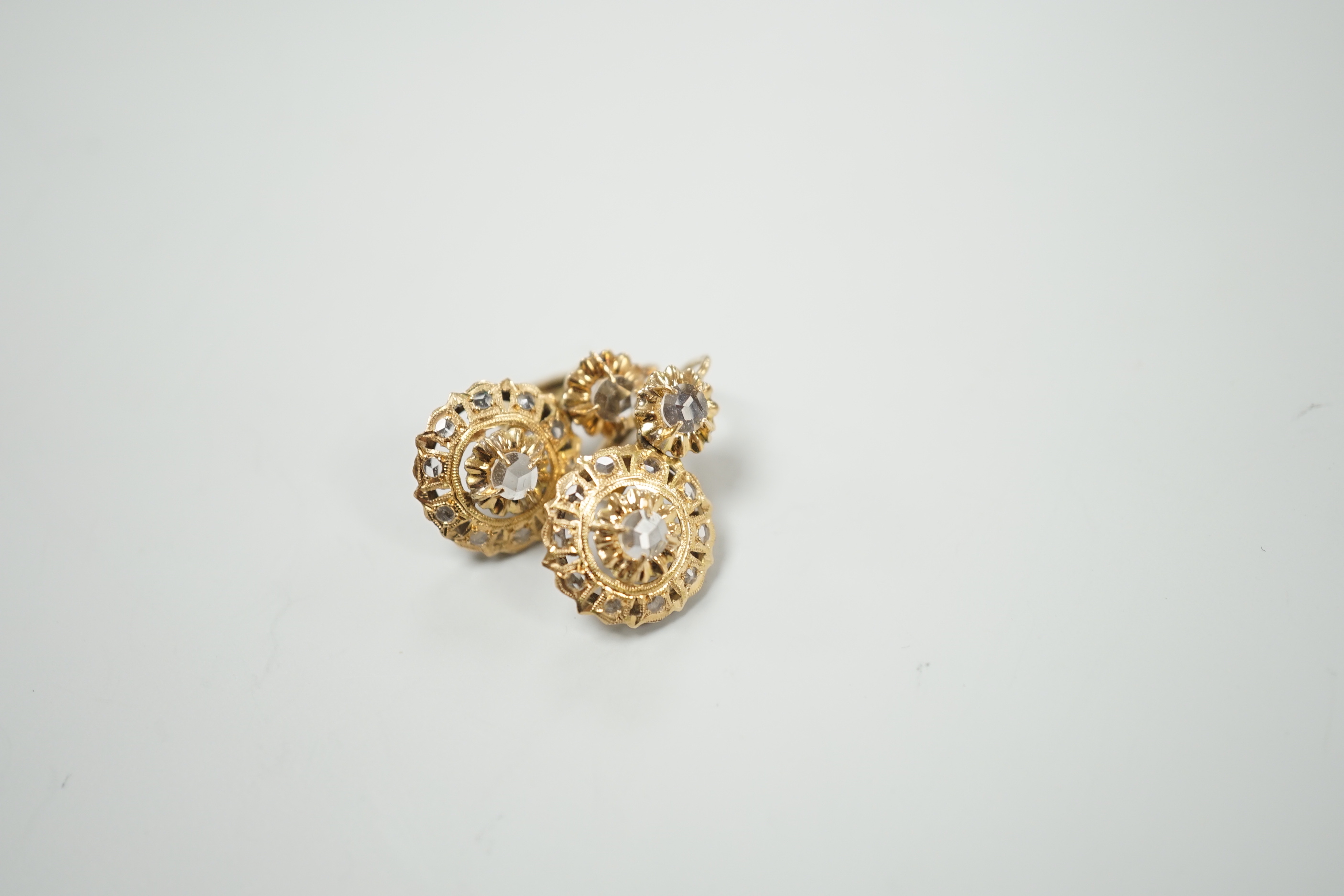 A pair of yellow metal and simulated rose cut diamond cluster set drop earrings, overall 21mm, gross weight 3 grams.